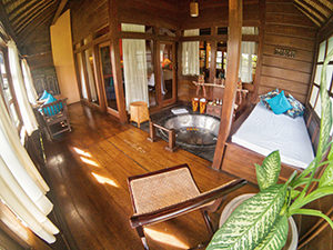 Private spa section of Rejang Suite, with a massage bed and sunken bathtub, in Tugu Bali, one of the best hotels in Bali, Indonesia, photo by Ivan Kralj