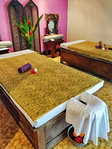 Wide massage beds at Tugu Bali spa, former storage chests for rice, photo by Ivan Kralj