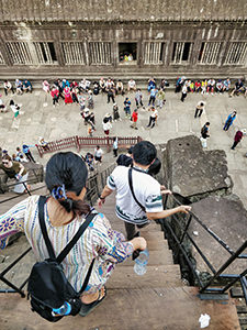 Tourists descending from the upmost level of Angkor Wat, the most famous Cambodian temple, photo by Ivan Kralj