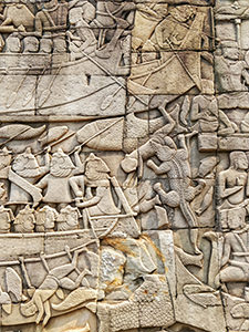 Crocodile eating a man in a bas relief on Bayon temple in Angkor Thom, Cambodia, photo by Ivan Kralj