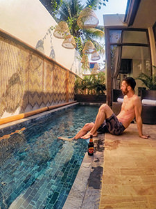 Pipeaway blogger, with Angkor beer, sitting by the private plunge pool at one of the rooms in Heritage Suites Hotel in Siem Reap, Cambodia, photo by Ivan Kralj