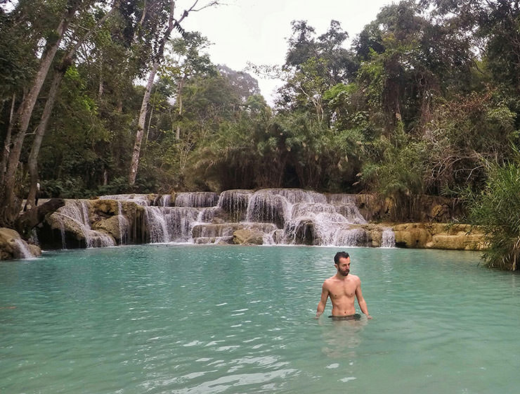 Pipeaway blogger Ivan Kralj standing in the waters of Kuang Si waterfalls in Laos, photo by Ivan Kralj
