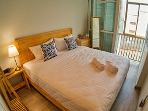 Bed in the King Room of Latima Boutique Hostel in Kanchanaburi, Thailand, photo by Ivan Kralj