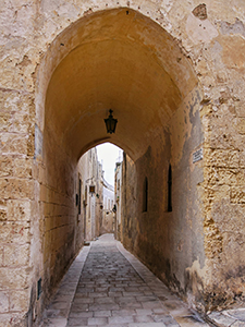 A narrow street in Mdina, Malta, photo by Ivan Kralj