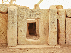 Door carved in stone at Mnajdra temple, one of megalithic temples in Malta, photo by Ivan Kralj