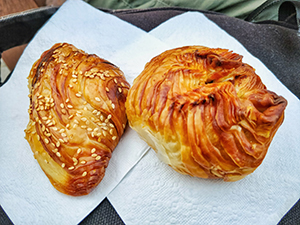 Eating pastizzi, Malta's national flaky pastry snack, is one of the best things to do in Malta, photo by Ivan Kralj