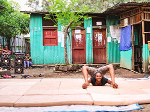 The contortionist training in the front yard of Arba Minch Circus, Ethiopia, photo by Ivan Kralj
