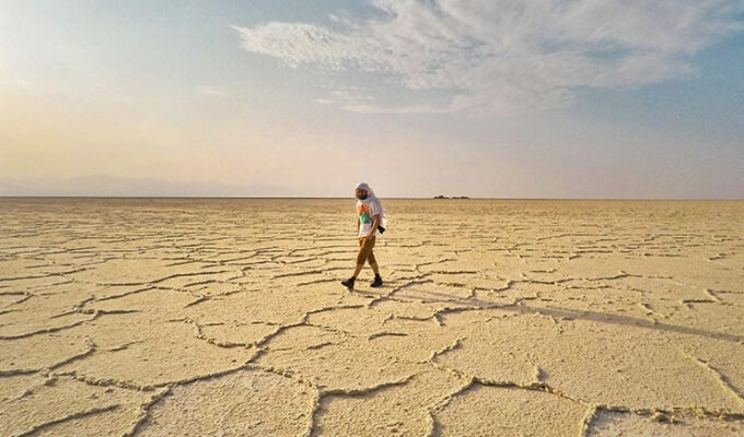 Pipeaway blogger Ivan Kralj, the travel writer of the week according to the Break into Travel Writing website, walks through the flat Danakil Desert in Ethiopia, photo by Ivan Kralj