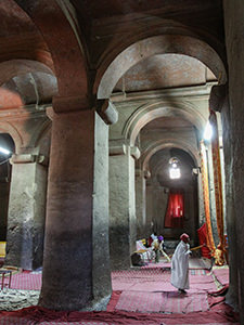 The interior of Bet Medhane Alem, Lalibela church that has 38 internal pillars, even if everything is actually a single piece of rock. This is is the largest rock-hewn chruch in the world! Lalibela, Ethiopia. Photo by Ivan Kralj