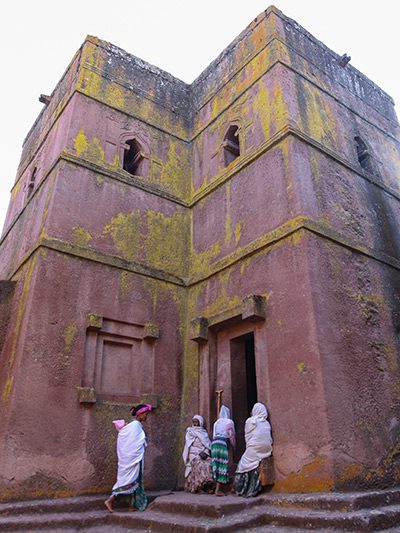 Women in front of the female entrance to Bete Giyorgis, the most fascinating rock-hewn church of Lalibela, Ethiopia, photo by Ivan Kralj