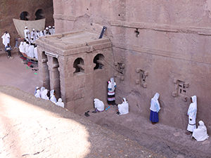 Men and women praying outside of Bete Maryam church, each on their own side, Lalibela, Ethiopia. Photo by Ivan Kralj