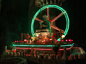 Sculpture of a seated Buddha decorated by neon lights in Am Phu cave in Vietnam's Marble Mountains, the Buddhist recreation of hell, photo by Ivan Kralj