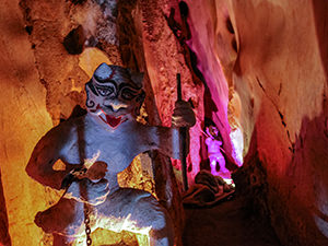 A demon chained in the Am Phu Cave, Buddhist representation of hell in the Marble Mountains, Vietnam, photo by Ivan Kralj