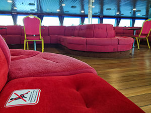 Seats on the Greek ferry are clearly marked with "do not sit" signs, in order to secure the safe distance between passengers, photo by Ivan Kralj