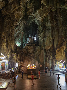 A cave shrine inside the Marble Mountain, with a great sculpture of Buddha, Da Nang, Vietnam, photo by Ivan Kralj