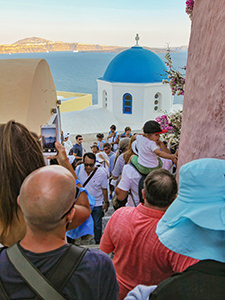 Overcrowded street in Oia before the pandemic, a popular destination for sunset, Santorini, Greece, photo by Ivan Kralj