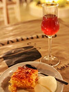 Orange cake with ice-cream and pomegranate raki liqueur served at To Elliniko, a restaurant in Naxos Town, Greece, photo by Ivan Kralj