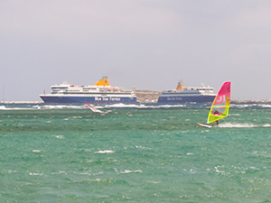 Blue Star Ferries behind the windsurfers as seen from Laguna in Naxos, Greece, photo by Ivan Kralj