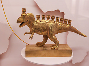 Golden plastic dinoasaur made in China fashioned into a Hanukkah lamp in Maine, USA, as displayed at Jewish Museum of Switzerland, one of the best museums in Basel, photo by Ivan Kralj