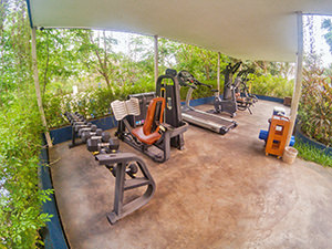 Open-air gym surrounded by tropical vegetation at Sakmut Boutique Hotel, Siem Reap, Cambodia, photo by Ivan Kralj