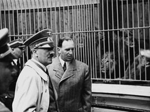 Adolf Hitler visiting the lion house at the newly built zoo in Nuremberg with Willy Liebel, mayor of Nuremberg, on May 2nd 1939
