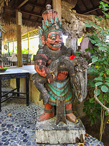 Antique sculpture at the entrance to Kokok Pletok restaurant at Hotel Tugu Lombok, Indonesia, photo by Ivan Kralj