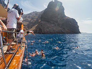 Participants of Tenerife whale watching excursion jumping from Shogun boat into the sea of Los Gigantes for a swim, Tenerife, Spain, photo by Ivan Kralj