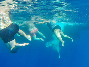 Swimmers stirring under the water surface at Los Gigantes, Tenerife, Spain, photo by Ivan Kralj