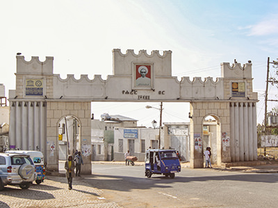 Bajaj passing through Duke's Gate, named after Ras Makkonen, the first duke of the walled city of Harar, Ethiopia, photo by Ivan Kralj
