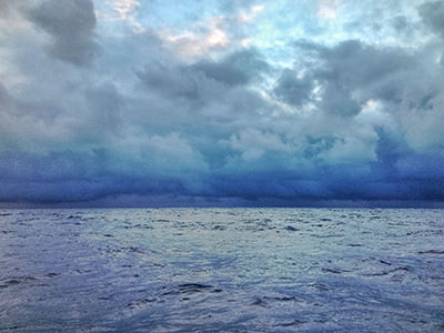 Clouds connected with the sea on the horizon during Bert terHart's trip around the world on a sailboat