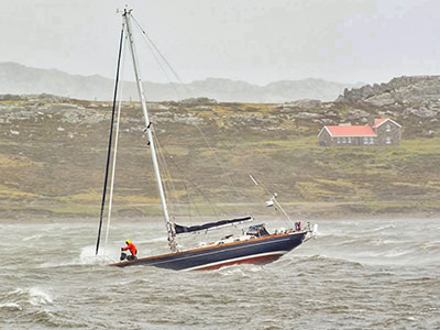 Bert terHart on his sailboat in wild sea