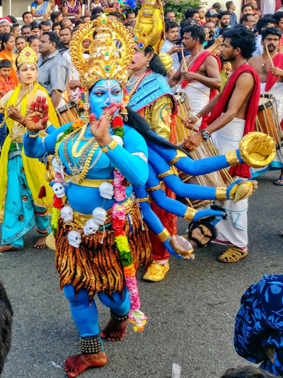 Masked as Hindu deities, people of Kerala join the New Year procession, photo by Kristina Gavran