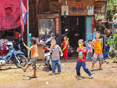 Children in the street of Battambang, Cambodia, fighting with water guns as a part of Khmer New Year celebrations, photo by Ivan Kralj