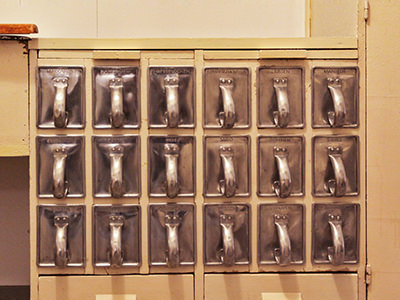 Organized set of 18 drawers in Maragete Lihotzky's Frankfurt Kitchen, for everything from rice and beans to powdered sugar, as exhibited at Vitra Design Museum, photo by Ivan Kralj