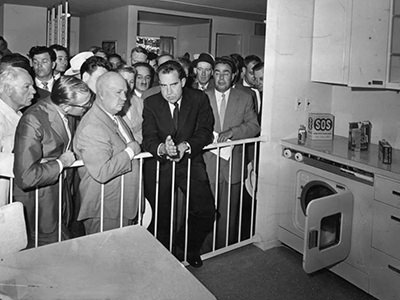 Photograph of Soviet first secretary Nikita Khrushchev and American vice-president Richard Nixon discussing capitalism and communism at the American National Exhibition in Moscow, in front of technically equipped American model kitchen. The debate became known as the Kitchen Debate. As exhibited at Vitra Design Museum in Weil am Rhein, Germany