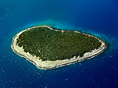 Mrtonjak, one of five heart-shaped islands in Adriatic Sea of Croatia, aerial photo by Boris Kačan