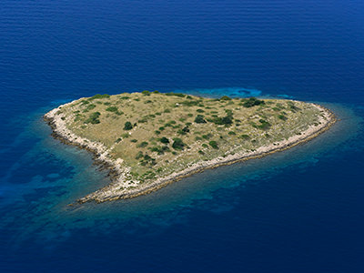 Rončić, one of five heart-shaped islands in Adriatic Sea of Croatia, part of Kornati Islands group, aerial photo by Boris Kačan