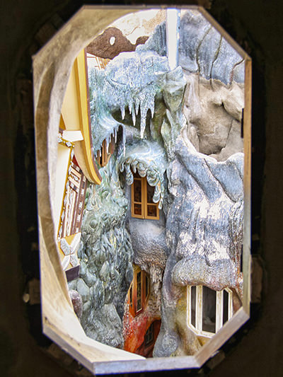 View through the window on the architecture of the Crazy House that seems as if wax was melting over its walls, Hang Nga Guesthouse, Vietnam, photo by Ivan Kralj