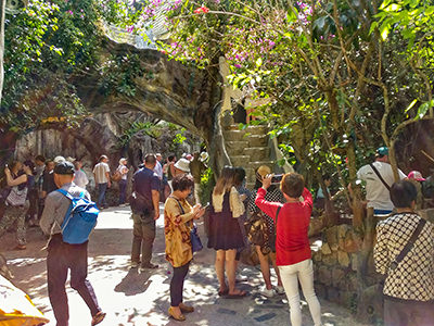 Tourists taking pictures in the courtyard of the Crazy House Dalat, Vietnam, photo by Ivan Kralj