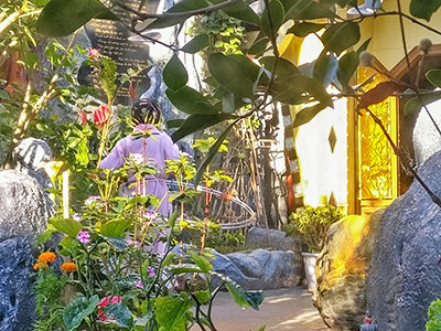 Dang Viet Nga, the architect of the Crazy House / Hang Nga Guesthouse, spinning the hula hoops in her backyard at early morning, Dalat, Vietnam, photo by Ivan Kralj