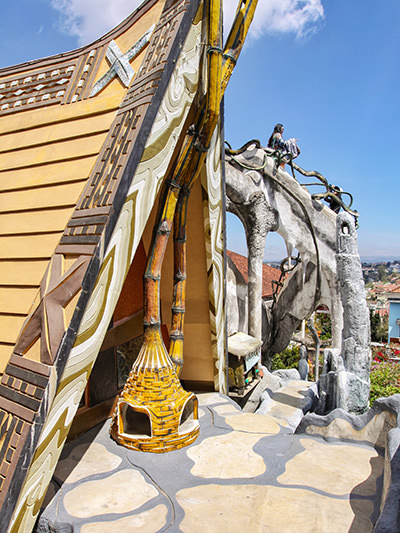 Outdoor fireplace in front of the Rong House visitors can climb over via odd concrete bridges, at Crazy Hosue Dalat in Vietnam, photo by Ivan Kralj