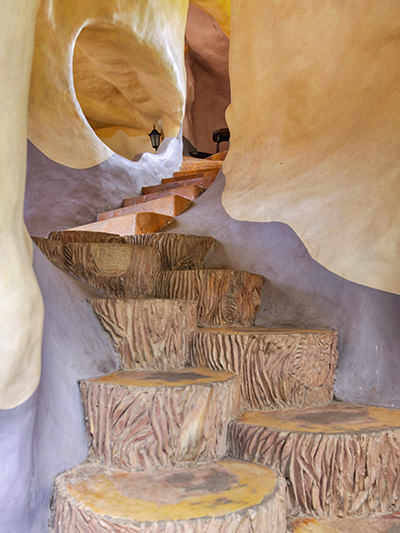 Odd staircase resembling tree stumps through the building of Crazy House Dalat / Hang Nga Guesthouse in Vietnam, photo by Ivan Kralj