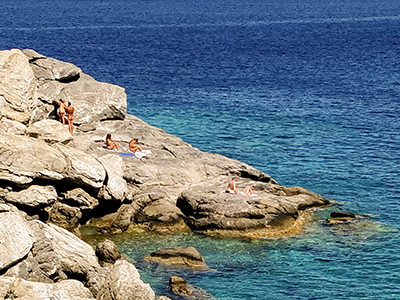 Nudists on the rocks of Agia Anna Beach in Amorgos, Cyclades, Greece, photo by Ivan Kralj