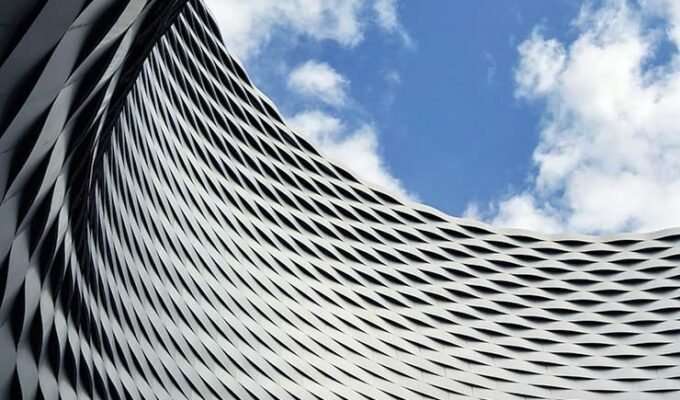 Basel Messe building with a "window to Heaven", an architectural masterpiece by Herzog & de Meuron. Exploring amazing architecture is one of the best free things to do in Basel, Switzerland. Photo by Ivan Kralj