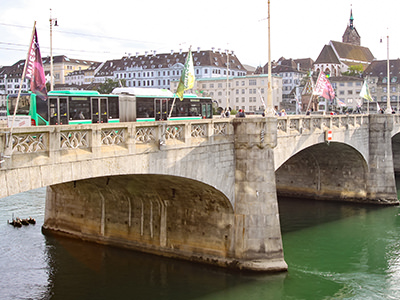 Bus crossing Mittlere Brucke - the Middle Bridge in Basel. Public transport is free for anyone staying in hotels in this Swiss city. Photo by Ivan Kralj 