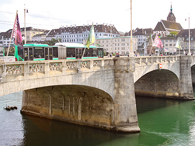 Bus crossing Mittlere Brucke - the Middle Bridge in Basel. Public transport is free for anyone staying in hotels in this Swiss city. Photo by Ivan Kralj