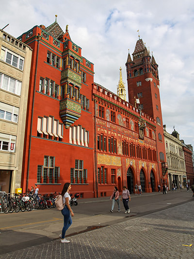 Visiting the red building of Basel's Town Hall, also known as the Rathaus, is on the list of the best free things to do in Basel, Switzerland. Photo by Ivan Kralj