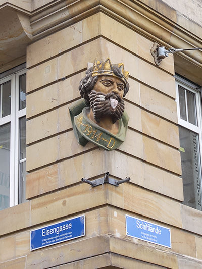 Basel Lallenkonig or the Tongue King, a sculpted head of a king with a tongue out, greeting visitors crossing to Grossbasel side via the Mittlere Brucke or the Middle Bridge in Basel, Switzerland. Photo by Ivan Kralj