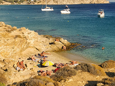 Nude men at Elia Beach in Mykonos, a tiny naturist hangout, photo by Ivan Kralj