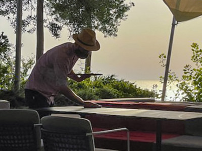 Blogger Ivan Kralj working as a waiter in summer season, wiping tables, photo by guest